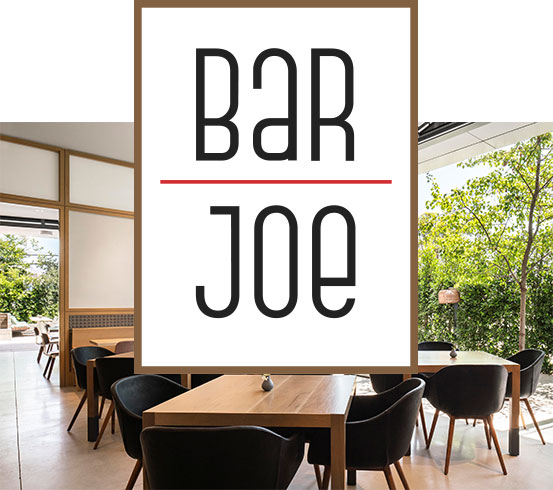 A drink and a table setting inside Bar Joe at Spoonfed